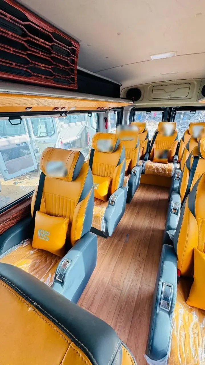 Aisle view down a Force Urbania cabin, with reclining seats either side
